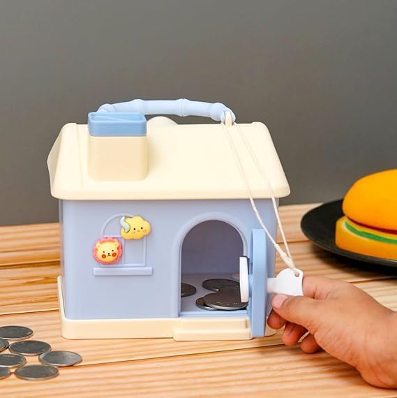 Kids' house money bank with lock, key, and 3D sticker compatibility, in pastel pink and blue.www.usmile.toys